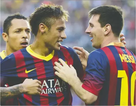  ?? JAVIER SORIANO/AFP/GETTY IMAGES FILES ?? Neymar, centre, and Lionel Messi celebrate a goal by Barcelona against archrival Real Madrid back in 2013. Messi says bringing back the Brazilian superstar would have been “a leap forward” for the La Liga champs, but no deal could be struck.