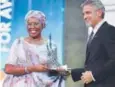  ?? Davit Hakobyan, The Associated Press ?? Actor George Clooney presents the first Aurora Prize to Marguerite Barankitse on Sunday.