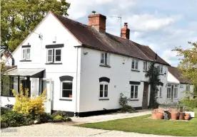  ?? ?? Picturesqu­e: The Thwaites’ £650,000 cottage in Gloucester­shire