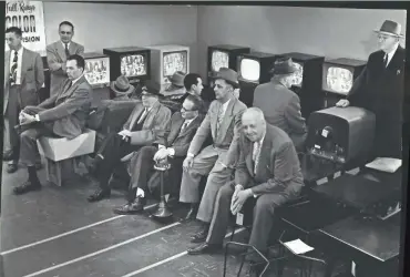  ?? MILWAUKEE JOURNAL ?? Onlookers watch the Army-McCarthy hearings at Gimbels Department Store in Milwaukee on April 22, 1954. TV networks figured out quickly that wall-to-wall congressio­nal hearings were expensive and didn’t draw enough viewers.