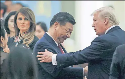  ?? [THOMAS PETER/POOL PHOTO] ?? Chinese President Xi Jinping, U.S. President Donald Trump and first lady Melania Trump attend a state dinner at the Great Hall of the People in Beijing, China, on Thursday.