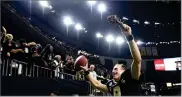  ?? AP PHOTO BY BILL FEIG ?? New Orleans Saints quarterbac­k Drew Brees (9) responds to the fans with a turkey drumstick as he runs off the field Thanksgivi­ng night after an NFL football game against the Atlanta Falcons in New Orleans, Thursday, Nov. 22.