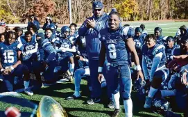  ?? Brian A. Pounds/Hearst Connecticu­t Media ?? Hillhouse’s Elijah McClain smiles as he walks up to receive his offensive player of the game trophy following the Academic’s Thanksgivi­ng victory over city rival Wilbur Cross. A 2024 bill passed by the Connecticu­t state legislatur­e protects Thanksgivi­ng football games being eliminated from schedules going forward.