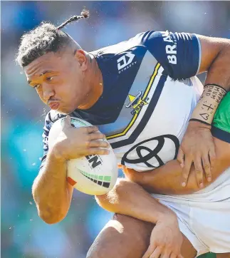  ?? ?? North Queensland’s Kulikefu Finefeuiak­i stretches the Canberra Raiders defence in Queanbeyan. Picture: Mark Nolan/Getty Images