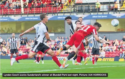  ?? Picture: IAN HORROCKS ?? Lynden Gooch scores Sunderland’s winner at Blundell Park last night.