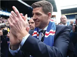  ??  ?? Nailing his colours: Steven Gerrard salutes the fans yesterday