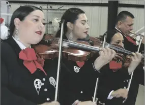  ?? BRYAN HELLIOS PHOTO ?? LEFT TO RIGHT: Mariachi Acero del Valle members Jennifer Wake, Yesenia Nevarez, Maritza Ruiz and Mariano Velez perform at the 80 annual Sportsman and Tomato Festival, on Sunday, February 5, in Niland.