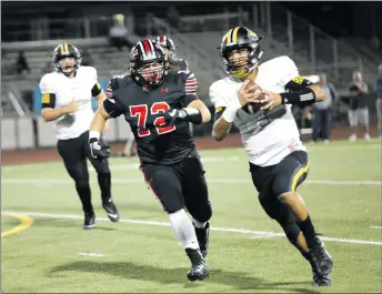  ?? Nikolas Samuels/The Signal ?? Hart player Thomas Bambrick (72) chases Ventura player Kyle Gerardi (1) on Thursday at Canyon High.