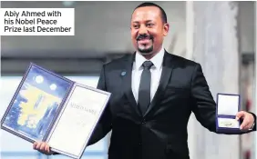 ??  ?? Abiy Ahmed with his Nobel Peace Prize last December