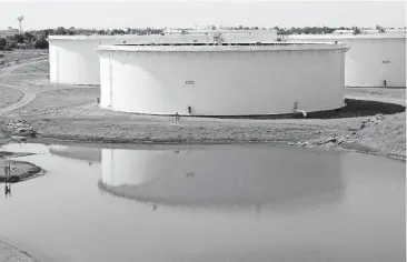  ?? [PHOTO BY PAUL HELLSTERN, THE OKLAHOMAN ARCHIVES] ?? BlueKnight Energy’s crude oil storage tanks are shown at the company’s Cushing storage hub, which is part of the country’s largest commercial storage center.