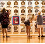  ??  ?? Rows and rows of records line the wall at the Country Music Hall of Fame and Museum in downtown Nashville.