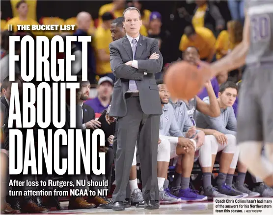  ??  ?? Coach Chris Collins hasn’t had many of the answers for his Northweste­rn team this season.
| NICK WASS/ AP