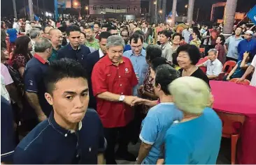  ??  ?? Fishing for votes: Dr Ahmad Zahid has hit the ground running in Sungai Besar. He was at the fishermen’s wharf area on Monday night where he met the Chinese community, many of whom are millionair­e fishermen.