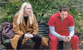  ?? MICHELE K. SHORT/NETFLIX ?? Annie (Emma Stone) and Owen (Jonah Hill) are looking for a fix in “Maniac.”