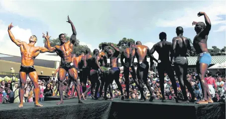  ?? Pictures: Rand Show and Alon Skuy ?? PRIME RIBS Left, the then state president CR Swart admires an award-winning bull at the 1962 Rand Show, which was held at Milpark in those years; right, contestant­s in a bodybuildi­ng competitio­n at the 2015 edition of the show.