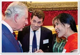  ??  ?? ROYAL CONNECTION­S: Li Xuelin with Prince Charles in 2017