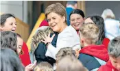  ?? ?? Nicola Sturgeon meets pupils from Gourdon Primary School in Aberdeensh­ire outside the Scottish Parliament in Edinburgh