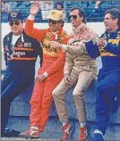  ?? Associated Press ?? Indy 500 champs: Indy 500 champs (from left) A.J. Foyt, Rick Mears, Danny Sullivan and Al Unser joke with the crowd as they stand along the pit wall at the Indianapol­is Motor Speedway on Saturday, May 21, 1988.