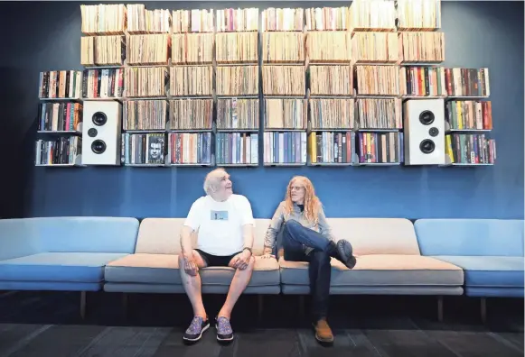  ?? JOE RONDONE/THE COMMERCIAL APPEAL ?? Former Ardent publicist and DJ John King, left, sits with archivist Jim Cole inside the Memphis Listening Lab, a new public space in the Crosstown Building, that allows patrons, researcher­s and the public to access his massive library of recordings.