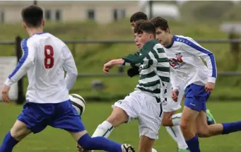  ??  ?? Daniel Gray-Harrigan in action for Strand Celtic v Merville.