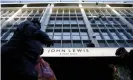  ??  ?? Shoppers walk past the John Lewis department store on Oxford Street. Photograph: Simon Dawson/Reuters