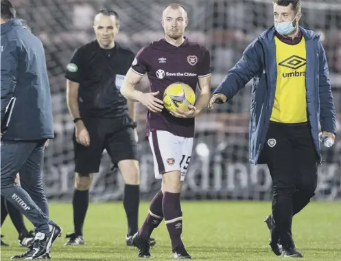  ??  ?? 0 Craig Wighton holds the match ball following his treble for Hearts against Raith Rovers in the Betfred Cup at Tynecastle.