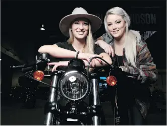  ?? LEAH HENNEL ?? Calgary Motorcycle Show attendees Lauren Reschke, left, and Erin Woon are members of The Litas, an all-women motorcycle collective with chapters in more than 175 cities in 25 countries.