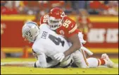  ?? Heidi Fang Las Vegas Review-Journal @HeidiFang ?? Raiders quarterbac­k Derek Carr is sacked by Chiefs defensive end Chris Jones on Dec. 1 in Kansas City, Mo.