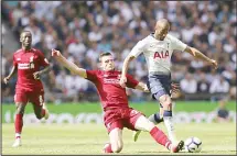  ??  ?? Liverpool’s Andrew Robertson (center), challenges for the ball with Tottenham’s Lucas Moura during the English Premier League soccer match between Tottenham Hotspur and Liverpool at Wembley Stadium in Londonon Sept 15. (AP)