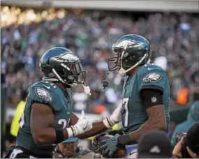  ?? RICK KAUFFMAN — DIGITAL FIRST MEDIA ?? Eagles receiver Alshon Jeffrey, right, celebrates a touchdown reception with teammate Kenyon Barner, left.