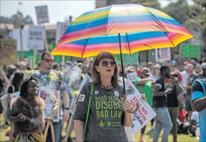  ?? Photo: by Alet Pretorius/getty Images ?? Planting the seeds: Myrtle Clarke, the director of the NGO Fields of Green for All, attends a protest as part of the Cannabis Mass Action Gathering at the Union Buildings in Pretoria. The organisati­on has been promoting harm reduction principles for the supply of safe cannabis.