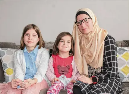  ?? Provided by Hana Emso Canbaz ?? Hana Emso Canbaz, right, and her daughters prepare to mark their first Ramadan in the Capital Region. Originally from Bosnia, Canbaz moved to Clifton Park in August.