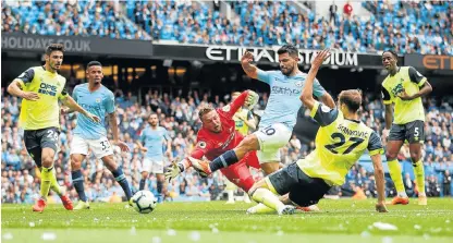  ?? /Reuters ?? Coming to a local screen: Manchester City’s Sergio Aguero, No 10, scores against Huddersfie­ld on Sunday. South African fans will soon be able to watch English Premier League matches live on SABC.