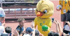  ?? AP ?? Fans cheer as Neymar leaves a training session.