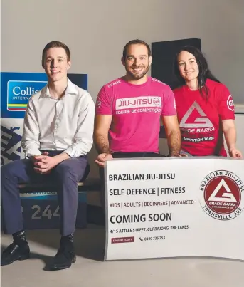  ?? Picture: SHAE BEPLATE ?? ALL MOD CONS: Ben Wheeler, Colliers Internatio­nal Townsville, Raony Condini and Helaina Bannister at the new premises for their Brazilian jiu jitsu studio, Gracie Barra.