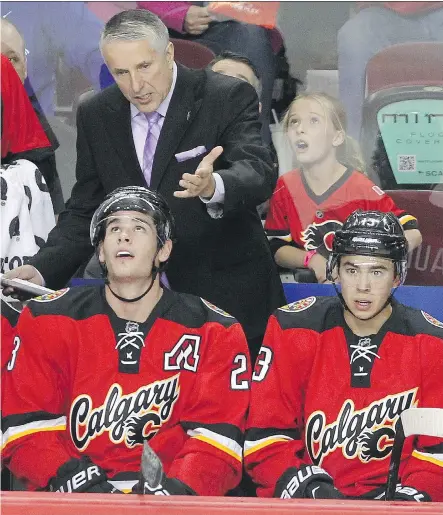  ?? CALGARY HERALD/ FILES ?? With the Flames’ losses mounting, speculatio­n is increasing that head coach Bob Hartley’s demanding style inside the room has worn thin with some players, that there is unrest behind the scenes and that they’ve tuned out the coach.