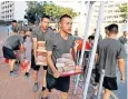  ??  ?? Troops from China’s People’s Liberation Army helped to clear-up protest debris