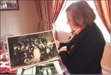  ?? Brian A. Pounds / Hearst Connecticu­t Media ?? Holocaust survivor Agnes Vertes holds a group photograph from her aunt and uncle’s wedding in Hungary at her home in Weston on Thursday. Vertes said that only three people in the photograph survived the Holocaust.