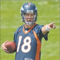  ?? By Ron Chenoy, US Presswire ?? Long way to go: Peyton Manning, shown at minicamp Tuesday, says, “I can’t emphasize enough that I still have rehab to do.”