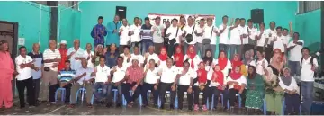  ??  ?? Dr Abdul Rahman (seated, seventh left) joins PBB Pantai Damai members and villagers of Kampung Bintawa Ulu in a group photo.