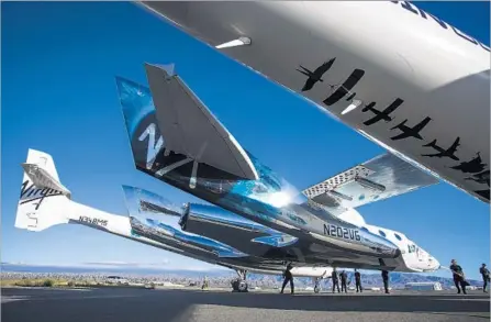  ?? Photograph­s by Oliver Ouyang Virgin Galactic ?? VIRGIN GALACTIC’S SpaceShipT­wo on its carrier in Mojave. The flight test is a sign the firm is recovering from a fatal 2014 incident.