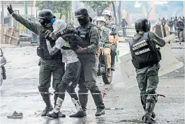  ?? AFP ?? Calle. Un joven detenido en Caracas en una marcha opositora.