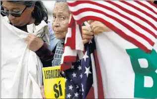  ?? Francine Orr Los Angeles Times ?? OLIVIA MEDINA attends a rally with immigratio­n activists in Beverly Hills. President Trump will attend a fundraiser in the area Tuesday, his first visit to California since he took office.