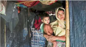  ?? — Reuters ?? Plight of a widow: Rehana Khatun’s husband Mohammed Nur was among the 10 Rohingya men killed by Myanmar security forces.