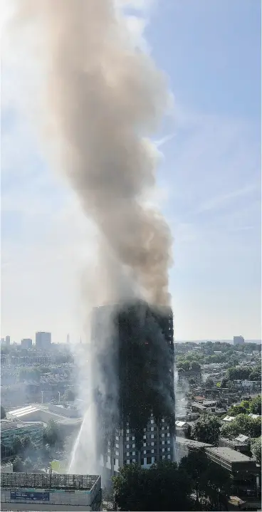  ?? VICTORIA JONES / PA VIA THE ASSOCIATED PRESS ?? “People were starting to appear at the windows, franticall­y banging and screaming,” says a witness of the deadly fire at Grenfell Tower in London, U.K., on Wednesday.