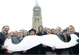  ?? /Reuters ?? Hairs and graces: Movember not only encourages the cultivatio­n of facial hair, as seen on these Canadian parliament­arians, but also shines a spotlight on men’s sexual and mental wellbeing.