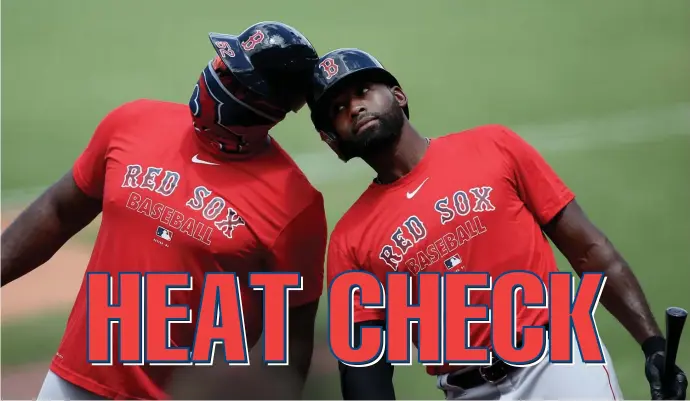  ?? Nancy lane / Herald staff ?? HOT AND COLD: Jackie Bradley Jr., shown here bumping helmets with Red Sox third base coach Carlos Febles yesterday, is usually streaky at the plate.