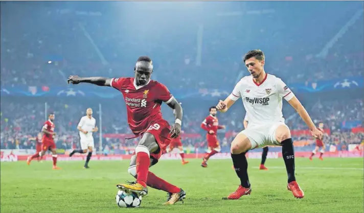  ??  ?? Red alert: After leading 3-0, Liverpool drew with Sevilla in this week’s Champions League game, betraying a lapse in concentrat­ion as the year wears on. Photo: Aitor Alcalde/Getty Images