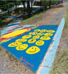  ?? Staff photo by Hunt Mercier ?? ■ Local residents have covered sections of sidewalk at the Bringle Lake Art Park with their own unique creations.