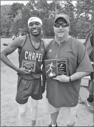  ?? Contribute­d Photo ?? High point winner: Parkers Chapel's Brian Smith (left) is pictured with coach Steven Bates (right) after competing in their district track meet in Monticello. Smith was the high point winner, as the Trojans won the district title.